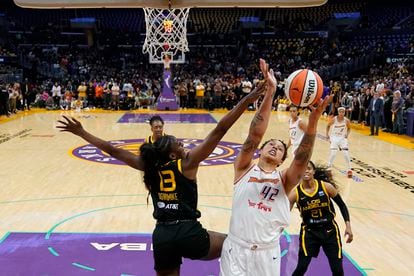 Los Angeles Sparks forward Chiney Ogwumike (13) defends against Phoenix Mercury center Brittney Griner (42) during the first half of a WNBA basketball game in Los Angeles, Friday, May 19, 2023.