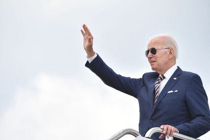 US President Joe Biden waves before boarding Air Force One on August 10.
