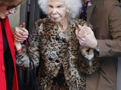 The Duchess of Alba leaves a Madrid restaurant with husband Alfonso Díez.
