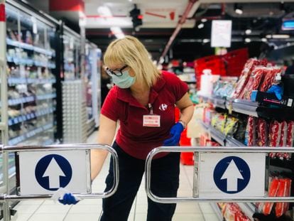 A worker disinfects a supermarket in March 2020.