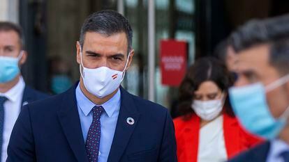 Spanish Prime Minister Pedro Sánchez  walking out of a meeting at Madrid regional headquarters.