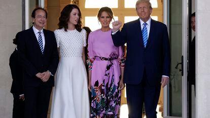 John Paulson and his partner Alina de Almeida receive Donald Trump and his wife Melania at their home in Palm Beach, Florida, on April 6, 2024.