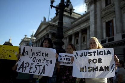 People hold a vigil outside Congress in support of Nisman.
