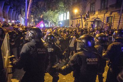 Police clash with protesters near the central government‘s delegate headquarters in Barcelona.