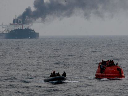 The crew of Brilliante Virturoso abandoned ship due to a fire aboard the vessel, in the picture they await rescue from US Navy sailors aboard their red lifeboat, on July 6th, 2011.