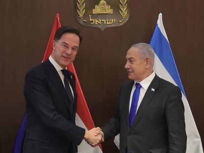 Dutch Prime Minister Mark Rutte (L) and Israeli Prime Minister Benjamin Netanyahu shake hands during their meeting at the prime minister's office in Jerusalem, February 12, 2024.