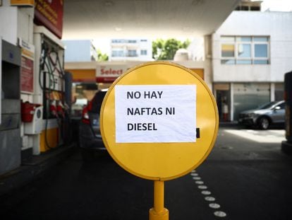 A sign reading "There is no NAFTAS (gasoline) nor diesel" is seen at a gas station during a gasoline shortage in Buenos Aires, Argentina October 30, 2023.
