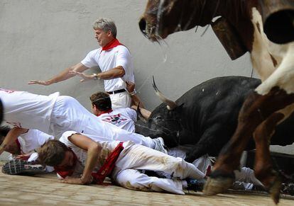 Bulls and runners collide at the 2009 fiestas.