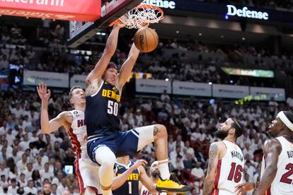 Denver Nuggets forward Aaron Gordon (50)dunks the ball during the first half of Game 4 of the basketball NBA Finals against the Miami Heat, Friday, June 9, 2023, in Miami.