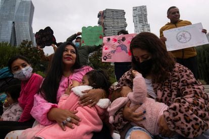 A group of women breastfeed their babies during a breastfeeding festival in Mexico City to address the social stigma of breastfeeding in public, on August 7, 2022. 