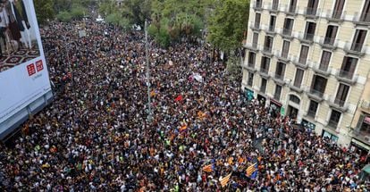 People throng the streets of Barcelona during Tuesday’s general strike.