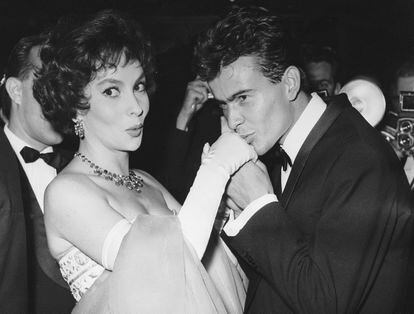 German actor Horst Buchholz kisses the hand of Italian actress Gina Lollobrigida, during the International Film Festival (Berlinale) in Berlin, Germany, July 5, 1958.