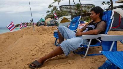 Carlos Lamas looks out to the sea from his spot at the "Fish-in" protest on, Friday, Dec. 1, 2023, in Lahaina, Hawaii.