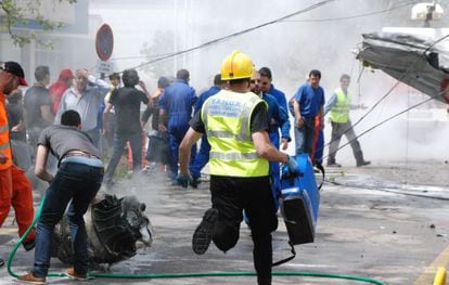 An emergency medic rushes to the scene of the fatal crash on Sunday at the Cuatro Vientos airport in Madrid. 