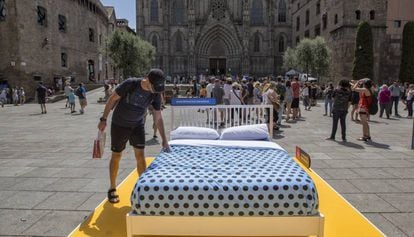 A bed placed by City Hall in Barcelona’s Plaza de la Catedral.
