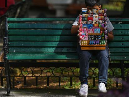 A young cigarette vendor takes a break in downtown Mérida.