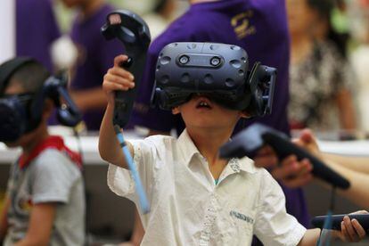 A child tries out augmented reality goggles at an animation festival in Kunming, China.