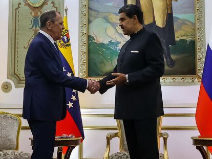 Venezuelan President Nicolas Maduro, right, meets with Russia's Foreign Minister Sergey Lavrov at Miraflores presidential palace in Caracas, Venezuela, Feb. 20, 2024.