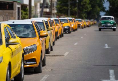 A long line of taxicabs waiting to refuel in Havana during Holy Week.