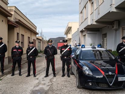 Italian police officers guard the street leading to Mattelo Messina's home in Campobello di Mazzara.