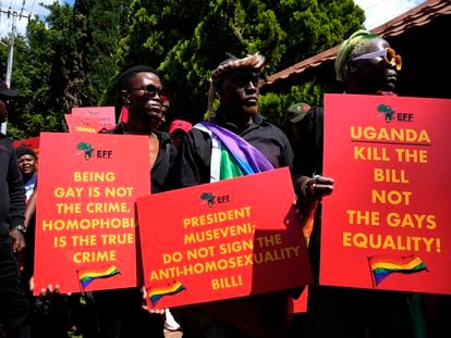 Activists hold placards during their picket against Uganda's anti-homosexuality bill at the Ugandan High Commission in Pretoria, South Africa, on April 4, 2023.