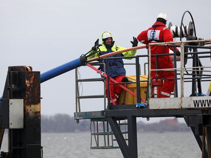 Workers deploy a submarine fiber optic cable between the German islands of Rügen and Hiddensee; February 2022.