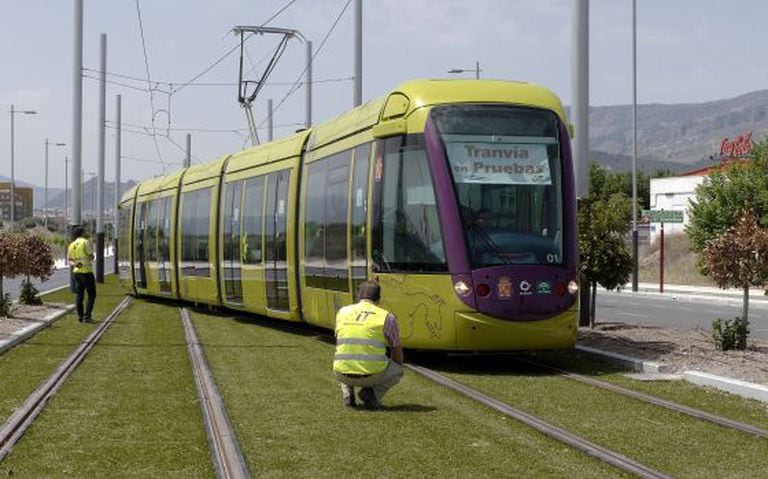Technicians inspect one of Jaén’s trams during a testing period in June 2012.