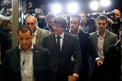 Catalan Regional Premier Carles Puigdemont arrives at a meeting with his PDeCat party.