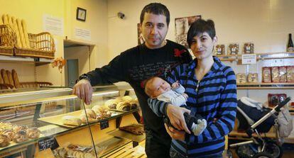 Jordi Cabau and Raquel Pérez with their son Asier, pictured in their fledgling bakery business.