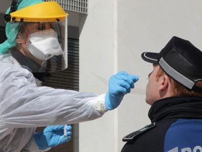 A local police officer in Madrid is tested for the coronavirus