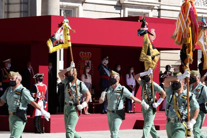Members of Spain's elite military unit La Legión march in front of the royal family. 