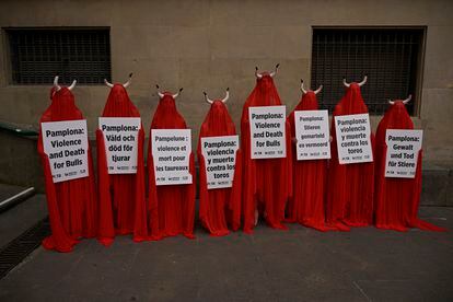 People covered with San Fermin's red color protested on Wednesday against animal cruelty before the start of the San Fermin festival in Pamplona.