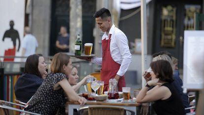 A Latin American waiter at a Madrid bar.