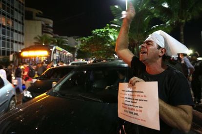 A protestor shouts outside the home of Rio de Janeiro Governor Sergio Cabral on Thursday.