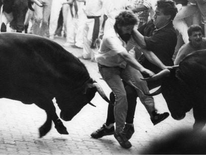 Runners and bulls collide at an encierro in 1988.