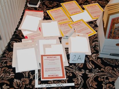 This image contained in a court filing by the Department of Justice on Aug. 30, 2022, and partially redacted by the source, shows a photo of documents seized during the Aug. 8 FBI search of former president Donald Trump's Mar-a-Lago estate.