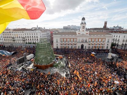 Demonstrators hold banners and Spain's flags during a protest called by right-wing opposition against an amnesty bill for people involved with Catalonia's failed 2017 independence bid, on Puerta del Sol square in Madrid on November 12, 2023.