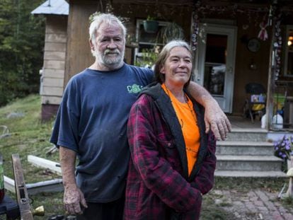 Randy and Alma McNeely outside their house in McDowell County.