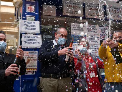 Lottery prize winners celebrate in Seville.
