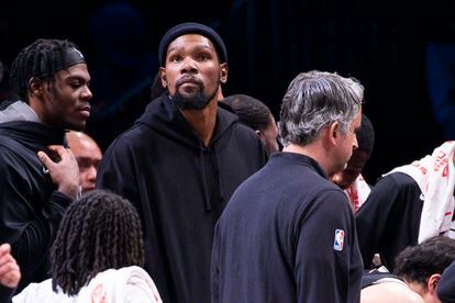 Brooklyn Nets forward Kevin Durant, center, looks on from the bench during the second half of an NBA basketball game against the Los Angeles Lakers, Monday, Jan. 30, 2023, in New York.