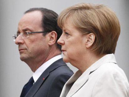 French president Fran&ccedil;ois Hollande and German Chancellor Angela Merkel together at their first official meeting last month.