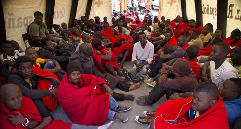A group of immigrants is treated by the Red Cross in Tarifa (Cádiz) after being rescued.