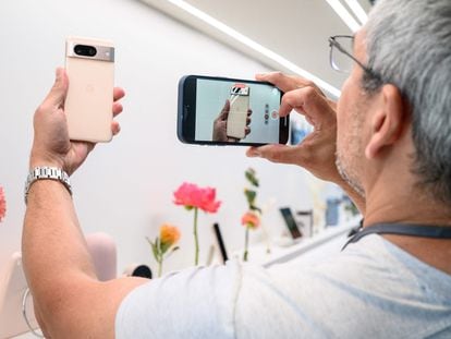 A potential buyer snaps a photo of the Google Pixel 8 Pro in New York; October 4, 2023.