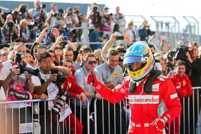 Fernando Alonso celebrates after finishing third at the US Grand Prix.