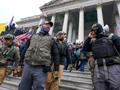 Members of the Oath Keepers extremist group stand on the East Front of the U.S. Capitol on January 6, 2021, in Washington.