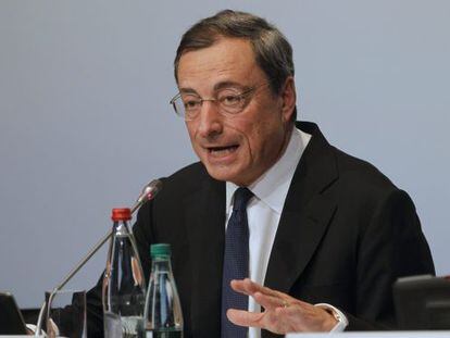 European Central Bank President Mario Draghi reacts to a question at a  post-meeting news conference in Paris on October 2.