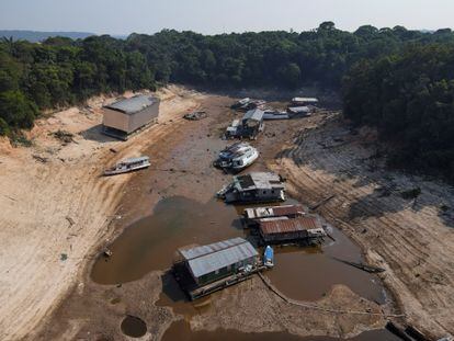 Boats and homes stranded due to low water levels on the Negro River, in Manaus.