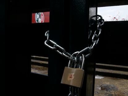 The doors of the headquarters of Mexico's Institutional Revolutionary Party, PRI, remain closed with chains in Mexico City, Wednesday, June 30, 2021.