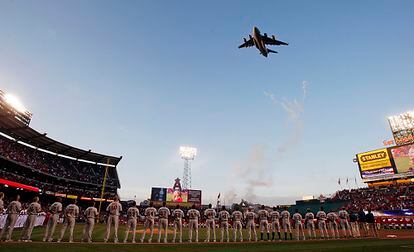 A C-17 Globemaster military aircraft flies over Angels Stadium in Anaheim during Opening Day celebrations in 2010.