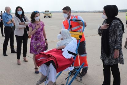 Defense Minister Margarita Robles greets an Afghan evacuee at the Torrejón de Ardoz air base on Wednesday.